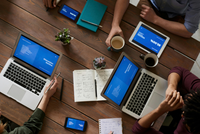 Picture of laptops on a desk showing collaboration